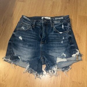 Risen distressed denim shorts